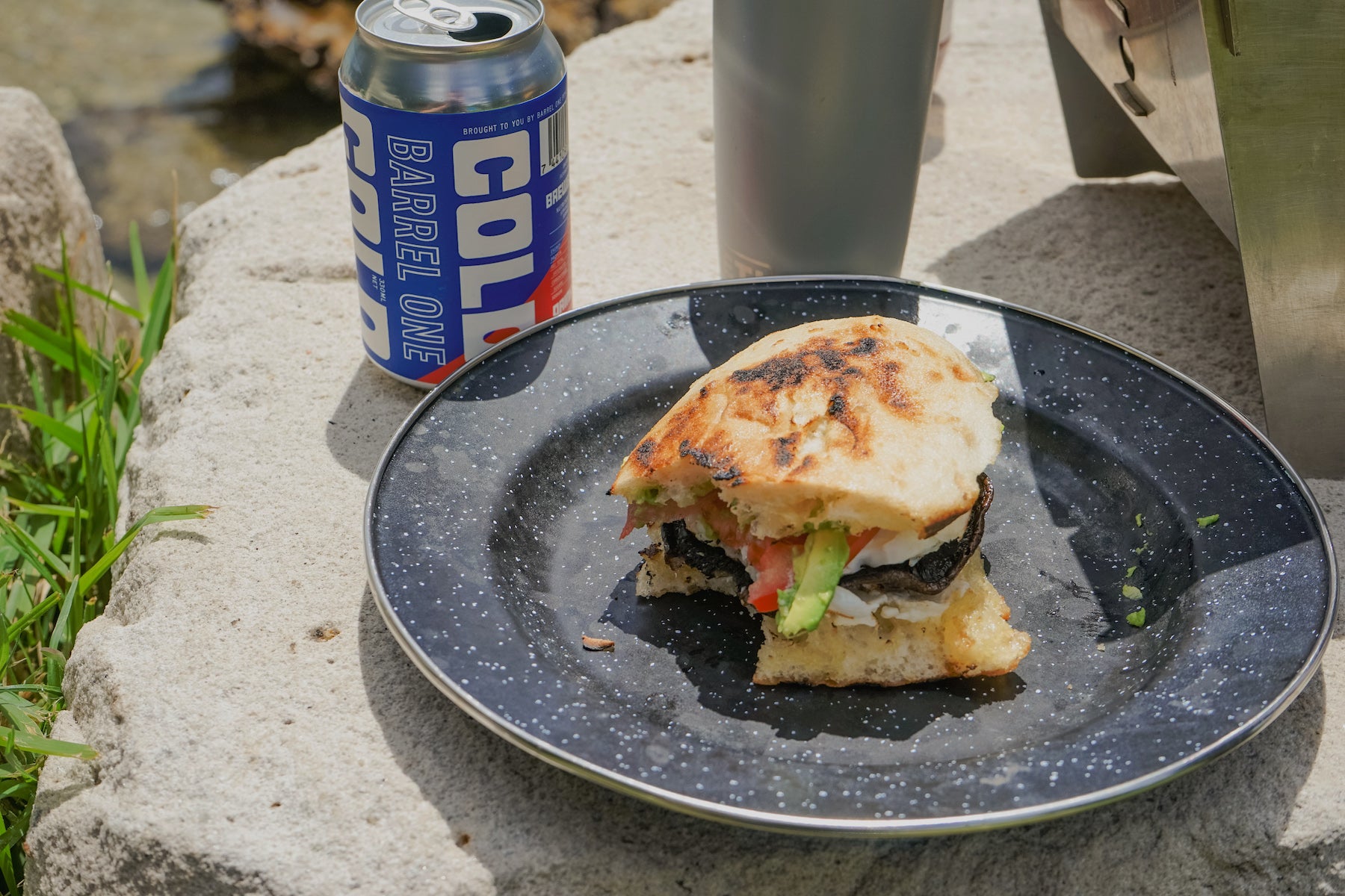 Veggie bread roll grilled on the portable STOV BBQ with coffee in the background