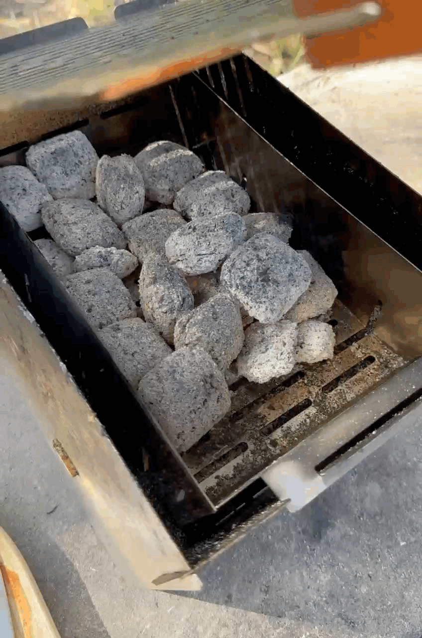 Cooking with charocal on the STOV BBQ the best portable BBQ in Australia