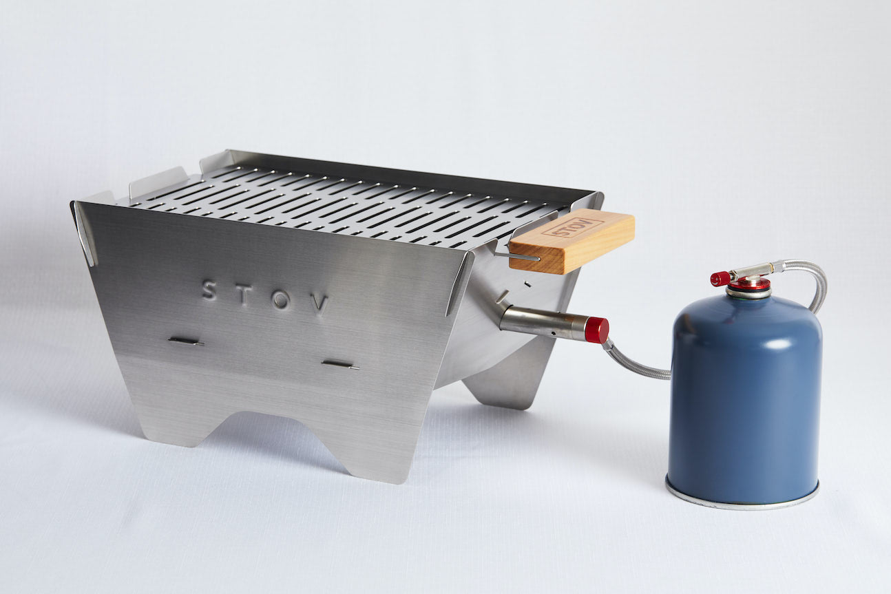 Side view with an angle STOV Portable Gas BBQ with propane gas bottle