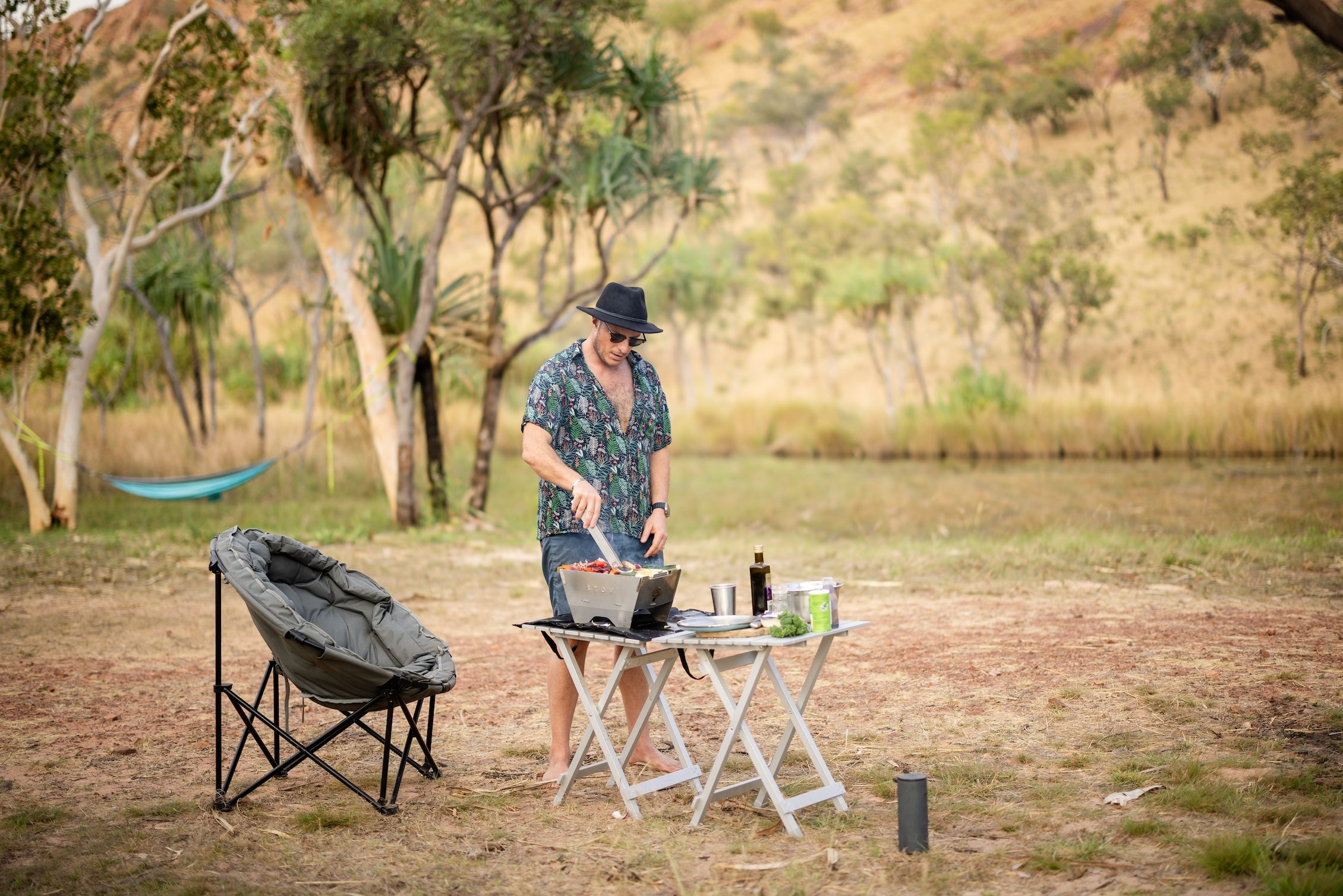 Cooking on the STOV BBQ a portable gas barbecue ideal for camping